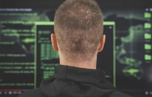 Cybercrime Prevention Tips Drucke: Hacker. Rear view. Hacking and internet security concept