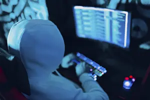 Cybercrime Prevention Drucke: Hacker using computer malware virus software and hacking binary code green digital interface