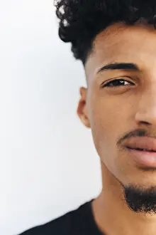 Young Black Man Drucke: Half face black young man