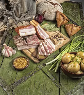 Diverse Food Photography Drucke: Ham and different vegetables on a studio background