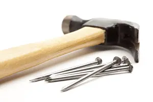 DIY Tools Drucke: Hammer and nails isolated on a white background