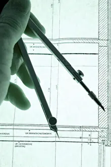 Construction Blueprint Details Drucke: Hand with dividers on a construction plan