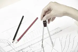 Construction Plan Drucke: Hand of engineer working on a construction plan