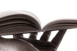 Office Work Stationery Drucke: Hand holding an open book