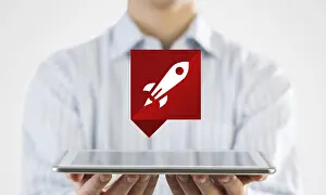 Medical Advertising Drucke: Hand holding tablet with rocket icon from screen