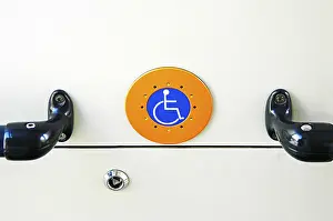 Wheelchair User Symbol Drucke: The Handicaped Button in the tramway