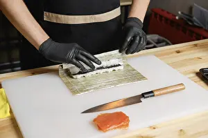 Healthy Meal Options Lunch Dinner Drucke: Hands of chef making salmon rolls