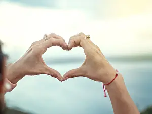 Conceptual Heart Picture Drucke: Hands together in a heart shape