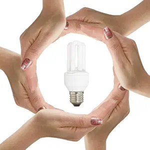 Bright White Background Cutout Drucke: Hands with light bulb isolated on white background