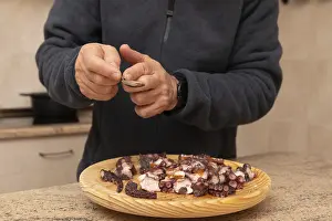Fresh Seafood Meal Ideas Drucke: Hands of a man in a cozy kitchen setting