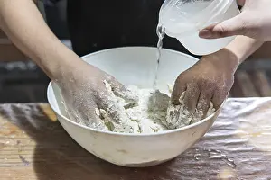 Meal Preparation Techniques Drucke: Detail of hands preparing dough for baking bread