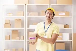 Handsome Contractor Drucke: Handsome contractor working in box delivery relocation service
