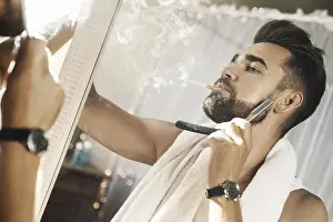 Personal Hygiene Importance Drucke: Handsome man looking in the mirror