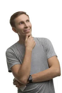 Young Male Model Drucke: Handsome man in plain clothes, looking up thoughtfully