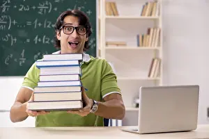 Handsome Student Drucke: Handsome student in front of chalkboard with formulas