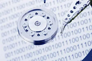 Plain Colored Background Image Drucke: The hard disc of a computer in front of a white background Austria