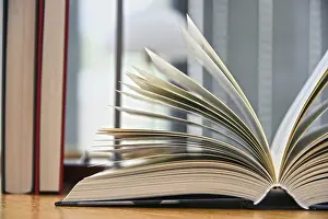 Educational Institution Drucke: Hardcover book lying on the table in a library