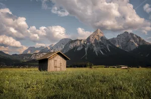 Austria Evening Sky Drucke: Haystack, hut in a meadow, Sonnenspitze at the back