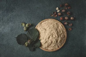 Nut Meal Powder Drucke: Hazelnut flour, top view, filbert