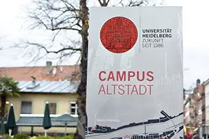 Southern Germany Educational Institution Drucke: Heidelberg, Germany, March 2019: Informational sign with red university emblem and words University Heidelberg