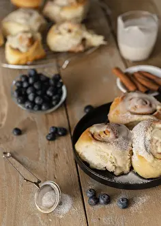 Elevated View Of Baked Goods Drucke: High angle cinnamon rolls blueberries