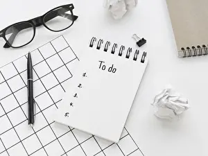 Office Work Space Drucke: High angle list notepad with glasses pen