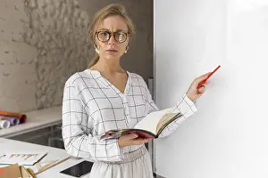 Educational Institution Photography Drucke: High angle teacher with book explaining lesson