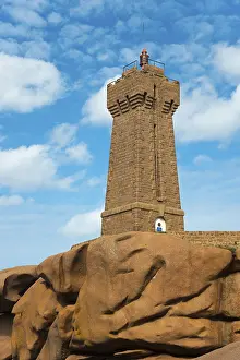 Blue Sky With Clouds Photo Drucke: High lighthouse on massive rocks in front of a blue sky with clouds
