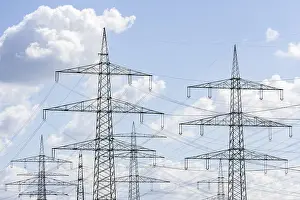 High Voltage Pylon Drucke: High-voltage pylons in front of cloudy sky