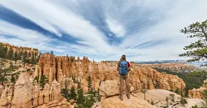 Bizarre Landscape Drucke: Hiker with backpack in bizarre landscape
