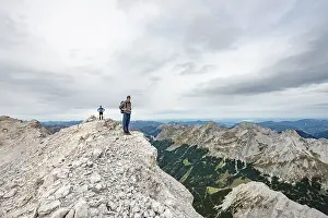 Hiker At Mountain Peak Drucke: Hiker at the summit of the eastern Odkarspitze