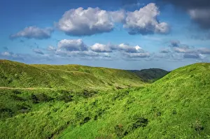 Empty Skies Photography Drucke: Hills with clouds and blue sky