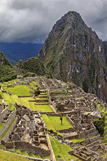 Cloudy Mountain Landscape Photography Drucke: Historic ruins and a dramatic mountain against a cloudy sky