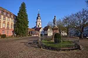 Historic European Cityscape Drucke: Historic square with a statue and a tower