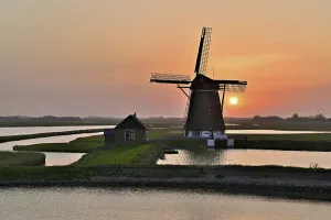 Texel Island Netherlands Drucke: Historic windmill in the light of the setting sun