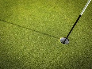 Recreational Activity Photo Drucke: Detail Of A Hole On A Golf Course With Pole And Copy Space