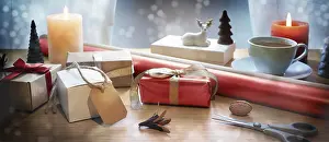 Holiday Gift Ideas Drucke: Holiday gift wrapping on a table with present boxes
