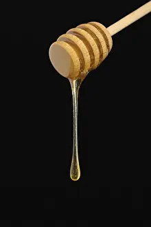 Adorable Food Still Life Drucke: Honey falling from a dripper