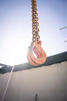 Construction Site Germany Drucke: Hook hanging on chain on construction site
