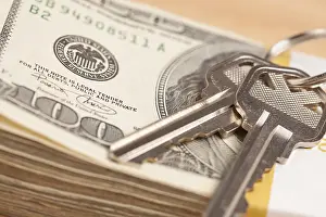 Cash For Keys Program Drucke: House keys on stack of money, cash for keys program