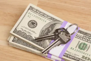 Cash For Keys Program Drucke: House keys on stack of money, cash for keys program