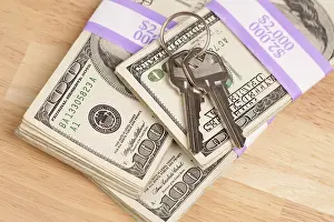 Cash For Keys Program Drucke: House keys on stack of money, cash for keys program
