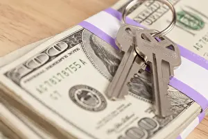 Cash For Keys Program Drucke: House keys on stack of money, cash for keys program