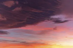 Western Europe Sunset Drucke: Huge orange cloud in the sky at sunset