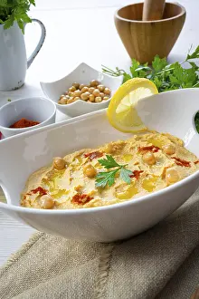 Arabic Cuisine Inspiration Drucke: Hummus paste with lemon and chilli on a white background