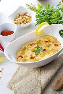 Arabic Cuisine Inspiration Drucke: Hummus paste with lemon and chilli on a white background