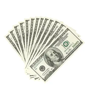 Bright White Studio Shot Drucke: Hundreds of dollars spread on white background