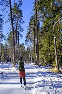 Engadin Landscape Photography Drucke: Ice skater, ice path through the forest