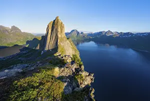 Atmospheric Light Of Sunset Drucke: Iconic mountain Segla with steeply sloping cliffs