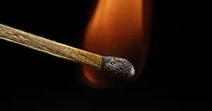 Black Background Image Drucke: Igniting Match against Black background